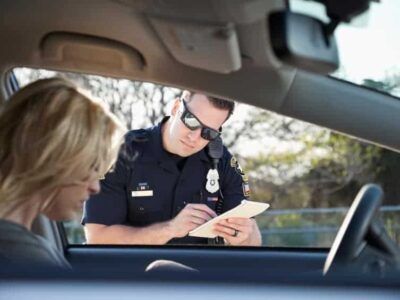 Police officer writing ticket