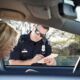 Police officer writing ticket